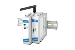 Illustration of wireless industrial I/O modules connected to sensors, control systems, and factory equipment through secure Wi-Fi networks. The image represents Acromag's BusWorks NTW Series, highlighting dual-band wireless connectivity, remote monitoring and control, industrial networking, IIoT integration, support for multiple I/O points, and seamless communication across modern industrial automation environments.
